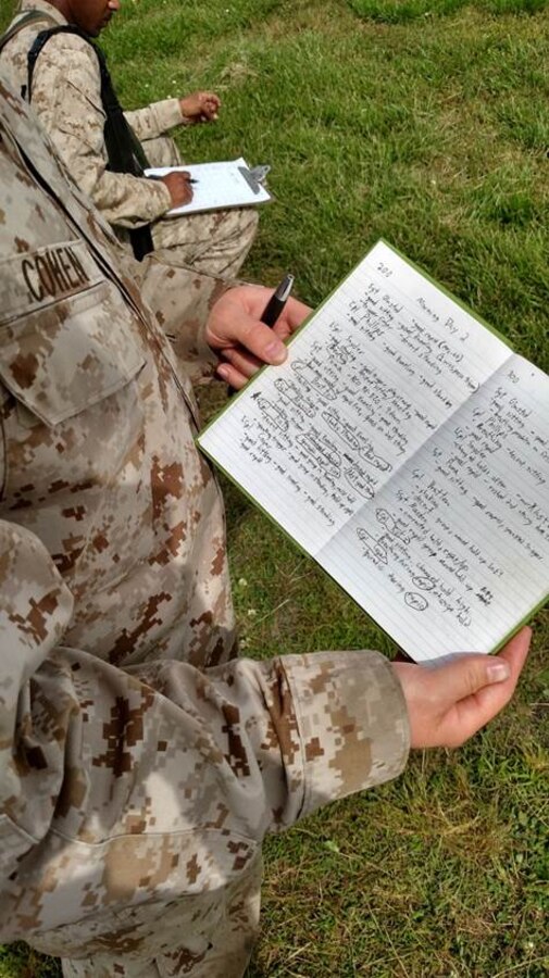8 May 2015 – LCpl Cohen, a Combat Marksmanship Coach with MAG-26, shows the detailed notes he kept to improve his shooters’ proficiency during annual rifle training aboard Stone Bay, NC.  LCpl Cohen was selected as the Charlie Range Coach of the Week for Firing Week 32.
