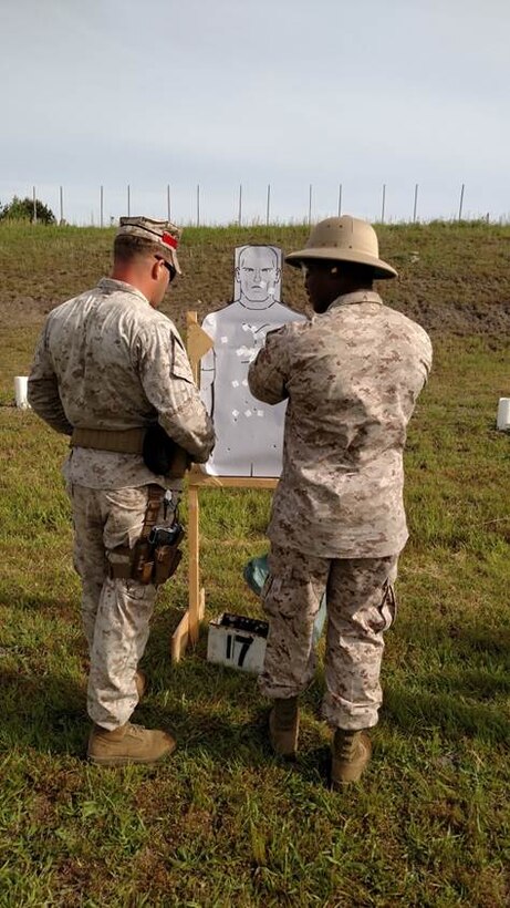 5 May 2015 – Sgt Hamilton, a Combat Marksmanship Coaches’ Course Instructor , gives a student recommendations during Combat Pistol Program training aboard Stone Bay, NC. 
