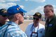 U.S. Air Force Col. Bruce Cox, 307th Bomb Wing commander, listens intently as Vietnam veterans of the wing tell their stories during a reunion at Barksdale Air Force Base, La., May 1, 2015.  The veterans, all of whom served at UTapao Royal Thai Navy Airfield, were treated to a tour of a B-52 Stratofortress and an unveiling of its new nose art designed in honor of Vietnam era veterans.  (U.S. Air Force photo by Tech. Sgt. Ted Daigle/released)