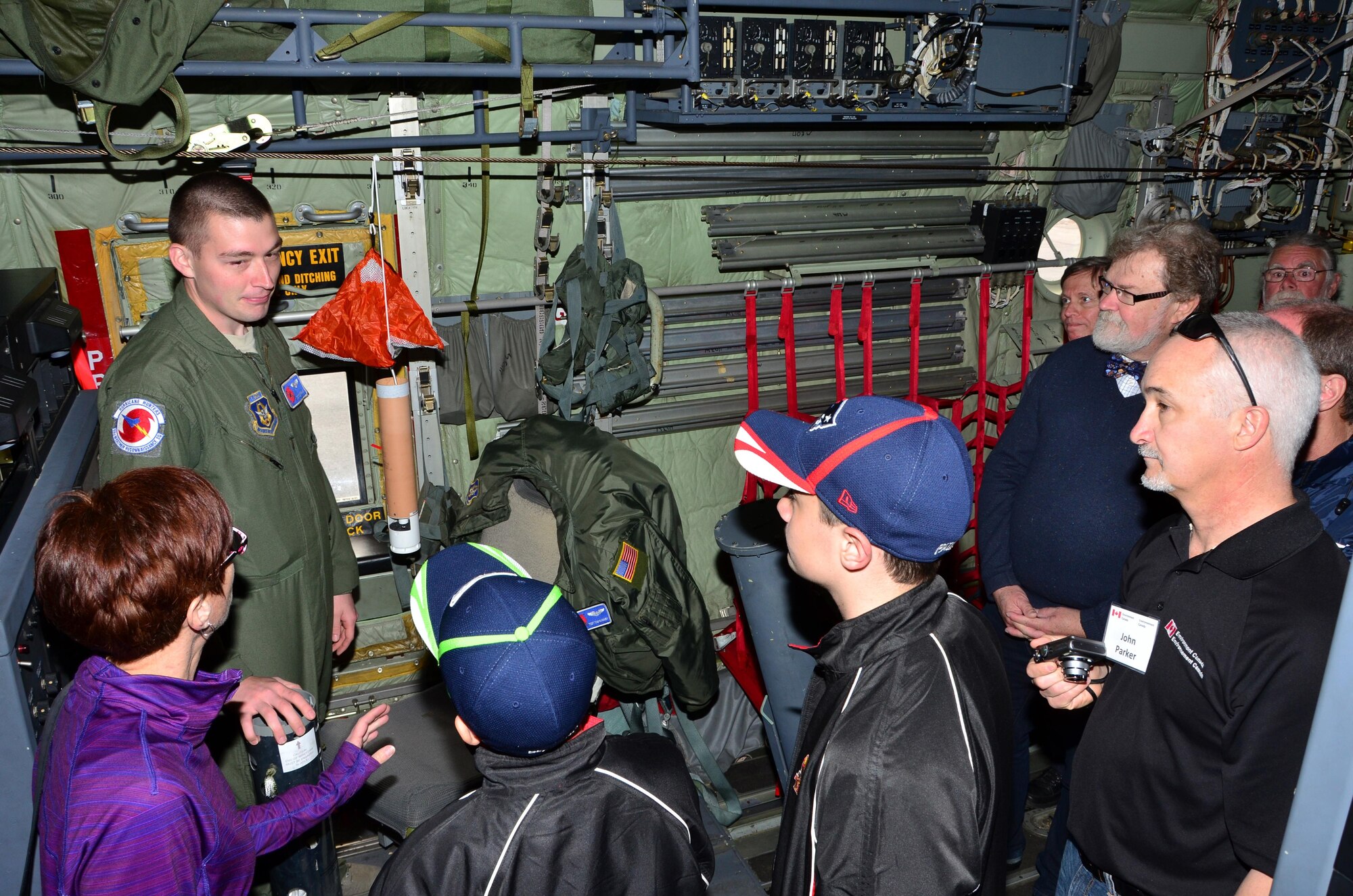 Tech Sgt. Tom Barnaby, a loadmaster with the 53rd Weather Reconnaissance Squadron Hurricane Hunters explains a dropsonde's ability to gather tropical weather data from within an eye of a hurricane to guests during the Halifax, Nova Scotia stop of the 2015 East Coast Hurricane Awareness Tour. (U.S. Air Force Photo/Master Sgt. Brian Lamar)