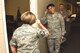 Maj. Gen. Stayce D. Harris, 22nd Air Force commander, returns the salute from Master Sgt. Spring Winters, 403rd Maintenance Group unit training manager, after giving her a 22nd AF commander’s coin May 3, 2015, for receiving the military individual volunteer of the year recently at the 32nd Annual City of Biloxi, Miss. Volunteer Recognition ceremony. Harris visited the 403rd Wing at Keesler Air Force Base, Mississippi, May 1-4 to interact with the Citizen Airmen and gain a better understanding of the organization and the wing’s mission. (U.S. Air Force photo/Tech. Sgt. Ryan Labadens)