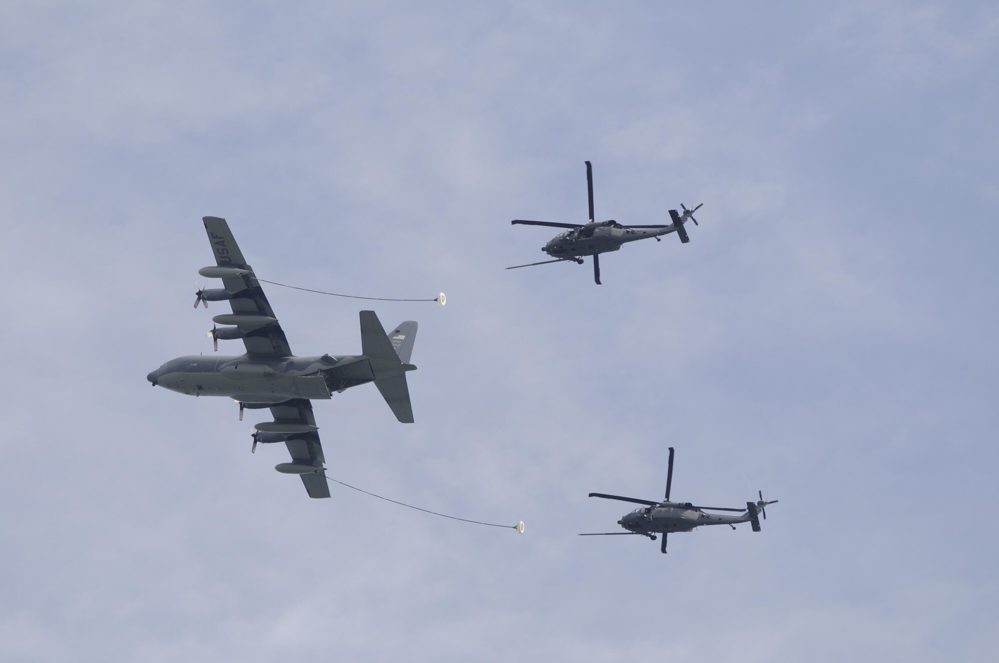 Air Force Reservists from the 920th Rescue Wing, Patrick Air Force Base, Florida, received an overall "Effective" rating April 24 - 26, 2015 by a 40-member AFRC Inspector General team under a brand new inspection process. Called Capstone, it is now a Commander's Inspection Program (CCIP) and it's led internally by a Wing Inspection Team (WIT). Shown here a crew of 920th Airmen refuel two Wing HH-60G Pave Hawk helicopters with their HC-130P/N King Air Refueler. (USAF photo) 
