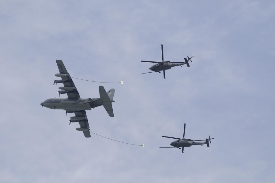 Air Force Reservists from the 920th Rescue Wing, Patrick Air Force Base, Florida, received an overall "Effective" rating April 24 - 26, 2015 by a 40-member AFRC Inspector General team under a brand new inspection process. Called Capstone, it is now a Commander's Inspection Program (CCIP) and it's led internally by a Wing Inspection Team (WIT). Shown here a crew of 920th Airmen refuel two Wing HH-60G Pave Hawk helicopters with their HC-130P/N King Air Refueler. (USAF photo) 
