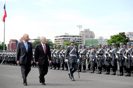 U.S. Defense Secretary Robert M. Gates, second from left, reviews the troops with Chilean Defense Minister Jaime Ravinet at Salon Bernado O'Higgins during an honors arrival ceremony commemorating Gates' visit to Santiago, Chile, Nov. 20, 2010.