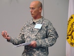 Army National Guard Command Sgt. Maj. Richard J. Burch briefs participants at the 2010 Association of the U.S. Army annual meeting and exposition in Washington D.C., Oct. 25, 2010. He issued a memorandum on Nov. 19, 2010 about the "New Norm," which makes asking for assistance a priority.