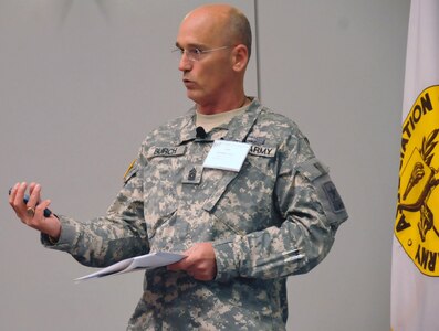 Army National Guard Command Sgt. Maj. Richard J. Burch briefs participants at the 2010 Association of the U.S. Army annual meeting and exposition in Washington D.C., Oct. 25, 2010. He issued a memorandum on Nov. 19, 2010 about the "New Norm," which makes asking for assistance a priority.