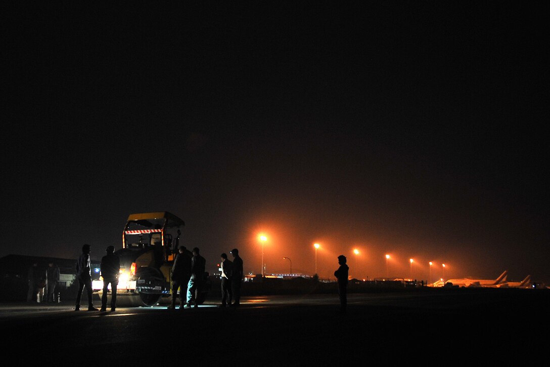 Members of the Civil Aviation Authority of Nepal, along with the 36th Contingency Response Group Airmen who are attached to Joint Task Force-505, work together to repair the runway at the Tribhuvan International Airport in Kathmandu, Nepal, May 10, 2015. Nepalese officials and Airmen teamed up to conduct necessary repairs to the airfield after it sustained damage following a magnitude 7.8 earthquake that struck the nation April 25. In response to the Nepal earthquake, the U.S. military sent Airmen, Marines, Soldiers and Sailors, as part of JTF-505, to support the humanitarian assistance and disaster relief mission in Nepal at the direction of U.S. Agency for International Development. (U.S. Air Force photo/Staff Sgt. Melissa B. White)
