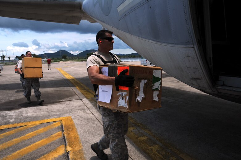 Tech. Sgt. Terrence Wright, an air transportation craftsman, loads a cooler containing units of blood bound for Kathmandu, Nepal, into a Marine Corps KC-130J Hercules at U-Tapao Royal Thai Navy Airfield, Thailand, May 10, 2015. A joint operations center established in U-Tapao serves as a staging point for JTF-505 aviation assets and key planners conducting humanitarian aid and disaster relief operations in response to the 7.8-magnitude earthquake that struck Nepal April 25. (U.S. Air Force photo/Staff Sgt. Alexander Martinez)