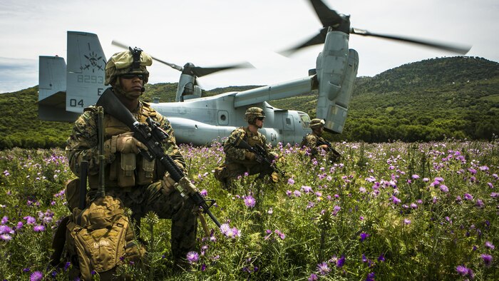U.S. Marine Lance Cpl. Victor CastilloGarcia, left, a field radio operator from Special-Purpose Marine Air-Ground Task Force Crisis Response-Africa, provides security for an MV-22B Osprey at a landing zone in Sierra Del Retin, Spain, May 4, 2015. The Marines landed at the site to conduct range operations with the Spanish Marines, who used the Osprey as part of their battalion’s training exercise.