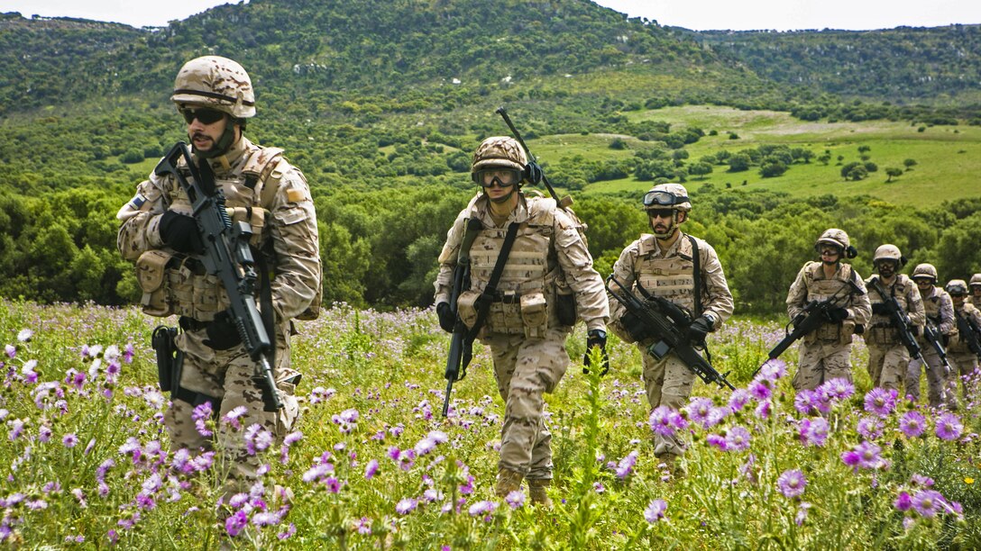 Spanish Marines from 2nd Battalion, Spanish Marine Brigade make their way to a landing zone before a training mission in Sierra Del Retin, Spain, May 4, 2015. The battalion used MV-22 Ospreys from Special-Purpose Marine Air-Ground Task Force Crisis Response-Africa to complete a training mission as part of its field exercise.