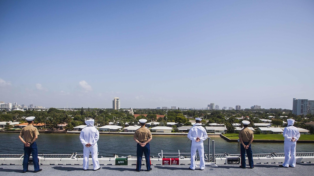 U.S. Marines and U.S. Navy Sailors with the 22nd Marine Expeditionary Unit and the amphibious assault ship USS Wasp man the rails of the Wasp as it leaves Port Everglades, Fla., May 10 at the conclusion of Fleet Week 2015. Marines and Sailors of the MEU, from Marine Corps Base Camp Lejeune, North Carolina, participated in Fleet Week Port Everglades May 4-10. The purpose of Fleet Week was to showcase the strength and capabilities of the Navy and Marine Corps team through tours, static displays and community relations events, and to provide the public the opportunity to meet and interact with Marines and Sailors.