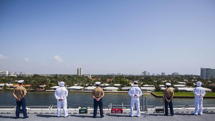 U.S. Marines and U.S. Navy Sailors with the 22nd Marine Expeditionary Unit and the amphibious assault ship USS Wasp man the rails of the Wasp as it leaves Port Everglades, Fla., May 10 at the conclusion of Fleet Week 2015. Marines and Sailors of the MEU, from Marine Corps Base Camp Lejeune, North Carolina, participated in Fleet Week Port Everglades May 4-10. The purpose of Fleet Week was to showcase the strength and capabilities of the Navy and Marine Corps team through tours, static displays and community relations events, and to provide the public the opportunity to meet and interact with Marines and Sailors.