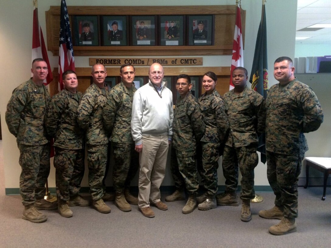 Marines with 1st Air Naval Gunfire Liaison Company, I Marine Expeditionary Force Headquarters Group, meet with the U.S. ambassador to Canada, Bruce A. Heyman during Exercise Maple Resolve 2015 at the Canadian Manoeuvre Training Center, Camp Wainwright, Alberta, May 9, 2015. Heyman visited Camp Wainwright to meet with the U.S. troops participating in Exercise Maple Resolve, a multi-national exercise, conducted annually by the Canadian Army, as a three-week high-readiness validation exercise for Canadian Army elements designated for domestic or international operations. (U.S. Marine Corps photo by Staff Sgt. Bobbie Curtis)