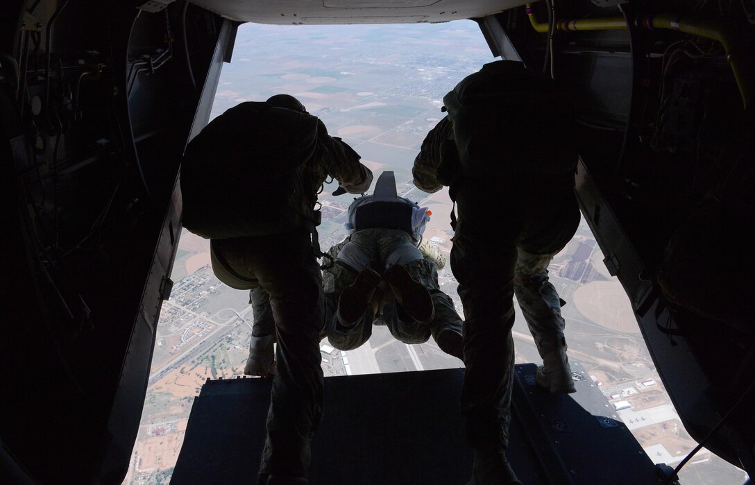 Chief Master Sergeant of the Air Force James Cody performs his first tandem parachute jump from a CV-22 Osprey over on May6, 2015, Cannon AFB, N.M. Cody toured Cannon to experience the 27th Special Operations Wing mission, meet Air Commandos and discuss common concerns such as the enlisted promotion system, changes to Air Force retirements, and strategies for resiliency.  (U.S. Air Force Photo/Master Sgt. Dennis J. Henry Jr.)