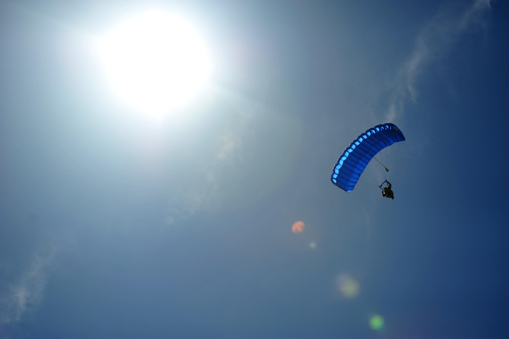 Seven members of the 26th Special Tactics Squadron parachuted out of a CV-22 Osprey during a tandem jump with Chief Master Sergeant of the Air Force James Cody, May 6, 2015 at Cannon Air Force Base, N.M. Cody toured Cannon to experience the 27th Special Operations Wing mission, meet Air Commandos and discuss common concerns such as the enlisted promotion system, changes to Air Force retirements, and strategies for resiliency. (U.S. Air Force photo/ Senior Airman Eboni Reece)