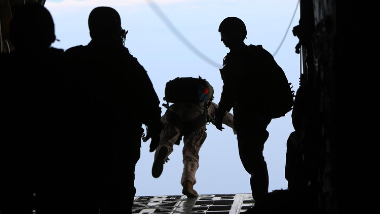 Critical skills operators with U.S. Marine Corps Forces Special Operations Command leap out of a KC-130J Super Hercules during parachute training above Marine Corps Base Camp Lejeune, North Carolina, May 6, 2015. CSOs were supported by Marine Aerial Refueler Transport Squadron 252 from Marine Corps Air Station Cherry Point, North Carolina. Aerial deliveries are one of the mission essential skills VMGR-252 provides in support of the Marine Air-Ground Task Force.