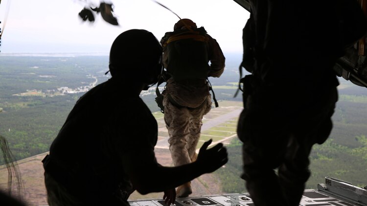 Critical skills operators with U.S. Marine Corps Forces Special Operations Command leap out of a KC-130J Super Hercules during parachute training above Marine Corps Base Camp Lejeune, North Carolina, May 6, 2015. CSOs were supported by Marine Aerial Refueler Transport Squadron 252 from Marine Corps Air Station Cherry Point, North Carolina. Aerial deliveries are one of the mission essential skills VMGR-252 provides in support of the Marine Air-Ground Task Force.