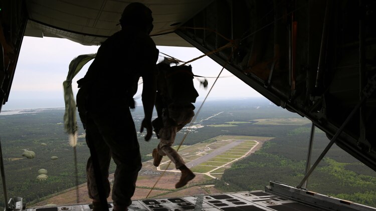 Critical skills operators with U.S. Marine Corps Forces Special Operations Command leap out of a KC-130J Super Hercules during parachute training above Marine Corps Base Camp Lejeune, North Carolina, May 6, 2015. CSOs were supported by Marine Aerial Refueler Transport Squadron 252 from Marine Corps Air Station Cherry Point, North Carolina. Aerial deliveries are one of the mission essential skills VMGR-252 provides in support of the Marine Air-Ground Task Force.