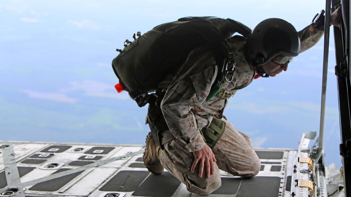 A critical skills operator with U.S. Marine Corps Forces Special Operations Command searches the horizon for the objective zone from the ramp of a KC-130J Super Hercules during parachute training above Marine Corps Base Camp Lejeune, North Carolina, May 6, 2015. CSOs were supported by Marine Aerial Refueler Transport Squadron 252 from Marine Corps Air Station Cherry Point, North Carolina. Aerial deliveries are one of the mission essential skills VMGR-252 provides in support of the Marine Air-Ground Task Force.