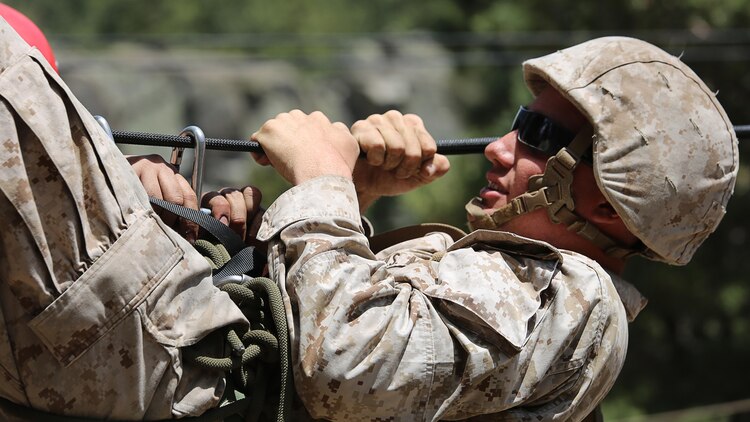 Cpl. Jordan Yearsley, combat engineer, Engineer Platoon, Headquarters and Service Company, Ground Combat Element Integrated Task Force, is secured under a rope during the rope gorge crossing event of a Marine Corps Operational Test and Evaluation Activity assessment aboard Marine Corps Mountain Warfare Training Center Bridgeport, California, May 5, 2015. From October 2014 to July 2015, the GCEITF will conduct individual and collective level skills training in designated ground combat arms occupational specialties in order to facilitate the standards-based assessment of the physical performance of Marines in a simulated operating environment performing specific ground combat arms tasks. 