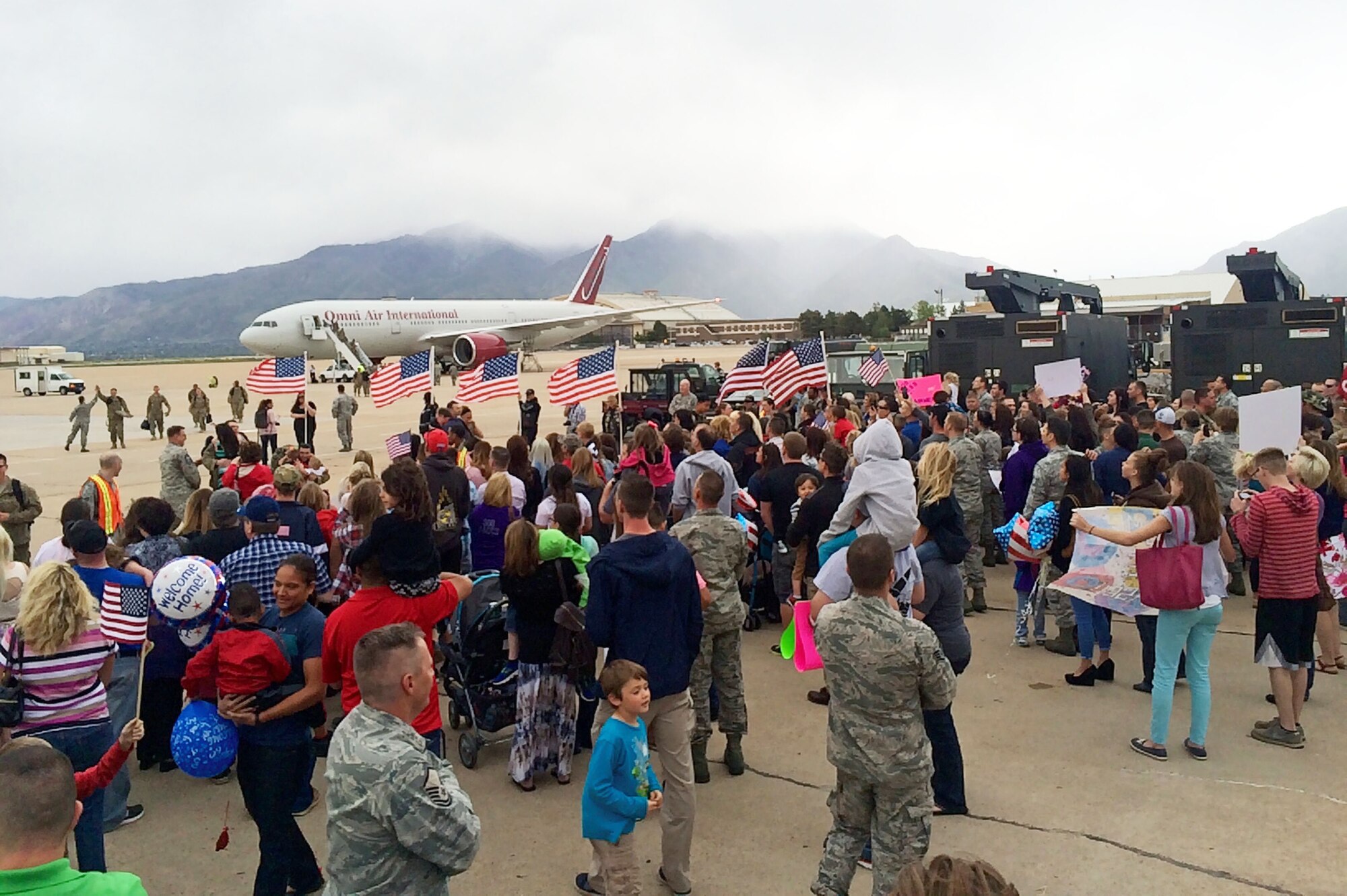 Families await loved ones returning from deployment at Hill Air Force Base, Utah. 