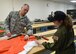 Master Sgt. Don McCormick, an aircrew life equipment craftsman with the 910th Airlift Wing, shows 12-year-old Celina Dennis of Poland, Ohio, how he inspects parachutes for defects here, May 6, 2015. Dennis was selected as the 910th Airlift Wing’s 61st Pilot for a Day, being sworn in as an honorary 2nd Lt. and treated to a day of military-themed activities here. Pilots for a Day are local children with chronic or life-threatening illnesses selected by Akron Children’s Hospital Boardman campus. (U.S. Air Force photo/Eric M. White)