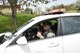 Staff Sgt. Adam Tyjeski, a fireteam member with the 910th Security Forces Squadron, takes 12-year-old Celina Dennis of Poland, Ohio, for a ride in his cruiser here, May 6, 2015. Dennis was selected as the 910th Airlift Wing’s 61st Pilot for a Day, being sworn in as an honorary 2nd Lt. and treated to a day of military-themed activities here. Pilots for a Day are local children with chronic or life-threatening illnesses selected by Akron Children’s Hospital Boardman campus. (U.S. Air Force photo/Eric M. White)