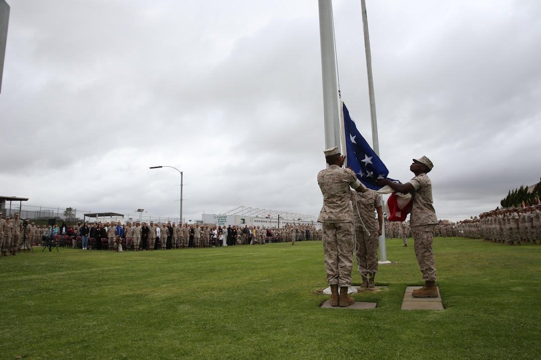 Marines with the 3rd Marine Aircraft Wing retire the evening's colors for a special spousal appreciation ceremony aboard Marine Corps Air Station Miramar, California, May 6. The evening's special guest was Maggie Coleman, widow of Jerry Coleman, a World War II and Korean War veteran.