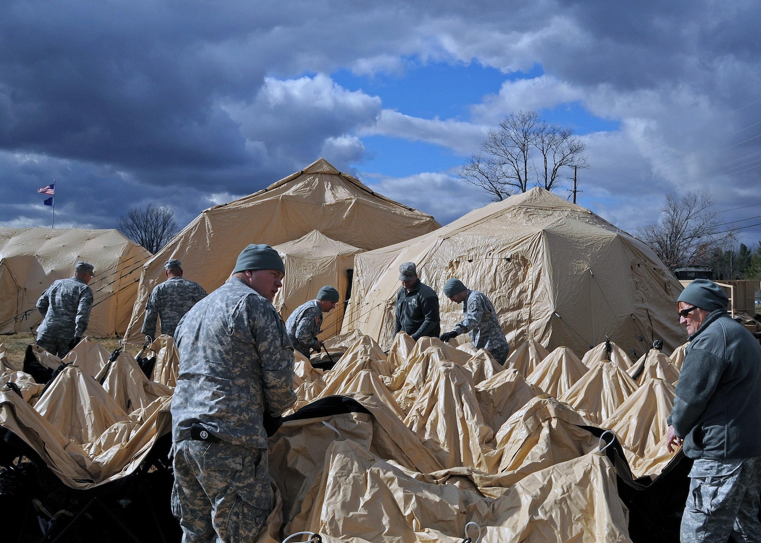 Soldiers from the 219th Battlefield Surveillance Brigade at Camp Atterbury
Joint Maneuver Training Center construct a Standardized Integrated Command Post System on Nov. 5, 2010 as training for their scheduled upcoming deployment to Iraq. A large tent provides more than 1,120 square feet of usable space. 