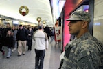 Pvt. Stephen Perez, a New York Army National Guardsman assigned to Joint Task Foce Empire Shield patrols at Penn Station on Nov. 23, 2010.