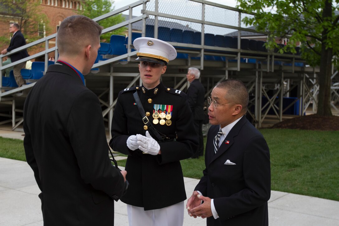 Cenon Naval II speaks with Marines before an Evening Parade at Marine Barracks Washington, D.C.,  May 1, 2015. Naval has attended every Sunset and Evening Parade since 1985. (U.S. Marine Corps photo by Cpl. Skye Davis / Released)