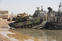 A U.S. Marine Corps M1A1 Abrams tank with the 24th Marine Expeditionary Unit debarks a U.S. Navy landing craft, air cushion hovercraft in support of Exercise Eager Lion 2015 at the Port of Aqaba in Jordan, April 28. EAGER LION is an annual, multinational exercise intended to share military expertise and promote interoperability. (U.S. Marine Corps photo by Cpl. Sean Searfus CE MARFOR CENTCOM FWD COMCAM/ Released)