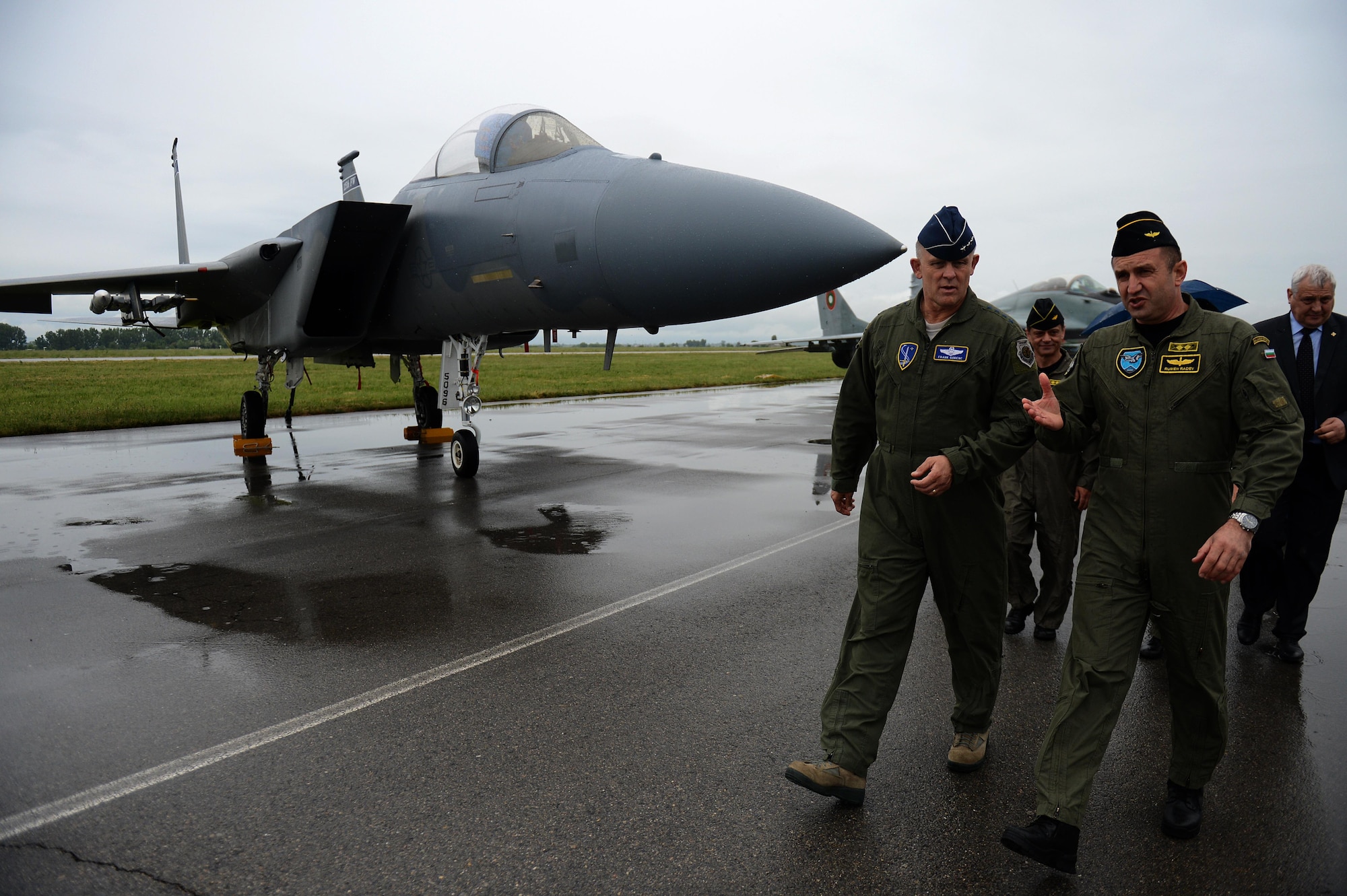 Gen. Frank Gorenc, the U.S. Air Forces in Europe and Air Forces Africa commander, walks with Maj. Gen. Rumen Radev, the Bulgarian Air Force commander, during a visit to Graf Ignatievo Air Base, Bulgaria, May 11, 2015. Airmen and F-15 Eagles from the 159th Expeditionary Fighter Squadron are part of Europe's first-ever theater security package deployment. The European TSP provides the opportunity for U.S. forces to train with NATO allies and is enabled by the strategic access provided by the infrastructure, support and host-nation relationships at U.S. and host-nation installations. (U.S. Air Force photo/Senior Airman Gustavo Castillo)