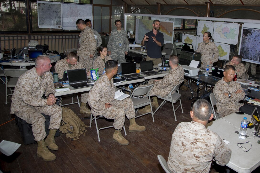 U.S. service members and aid workers from Joint Task Force 505 conduct a brief at the U.S. Embassy Annex in Kathmandu, Nepal, May 8. The Nepalese government requested assistance after a 7.8 magnitude earthquake struck the country, April 25. The U.S. government ordered JTF 505 to provide unique capabilities to assist Nepal.