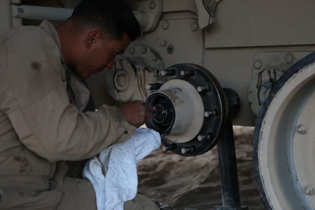 Corporal Christian Bills, gunner, Company A, 1st Tank Battalion, 1st Marine Division, nicknamed “America’s Company,” performs maintenance on his M1A1 Abrams Main Battle Tank named Star Lord during Exercise Desert Scimitar aboard Marine Corps Air Ground Combat Center Twentynine Palms, Calif., April 11, 2015. Desert Scimitar enables 1st Marine Division to test and refine its command and control capabilities and ensures 1st Marine Division units remain committed to consistently improving the quality of their training efforts and their resultant warfighting capabilities.