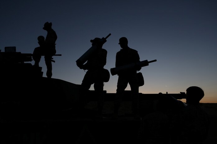 Marines with Company A, 1st Tank Battalion, 1st Marine Division, nicknamed “America’s Company,” load main gun rounds on to an M1A1 Abrams Main Battle Tank during Exercise Desert Scimitar aboard Marine Corps Air Ground Combat Center Twentynine Palms, Calif., April 11, 2015. The training gave the Marines the opportunity to refine and rehearse essential combat skills needed in a battlefield environment. Desert Scimitar is an annual exercise that includes elements from the I Marine Expeditionary Force. The exercise focused on conventional operations and provided realistic training that prepared Marines for overseas operations. (U.S. Marine Corps photo by Sgt. Christopher J. Moore/Released)