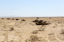 A line of M1A1 Abrams Main Battle Tanks are put into a defensive position during Exercise Desert Scimitar aboard Marine Corps Air Ground Combat Center Twentynine Palms, Calif., April 12, 2015. Desert Scimitar enables 1st Marine Division to test and refine its command and control capabilities and ensures 1st Marine Division units remain committed to consistently improving the quality of their training efforts and their resultant war fighting capabilities.
