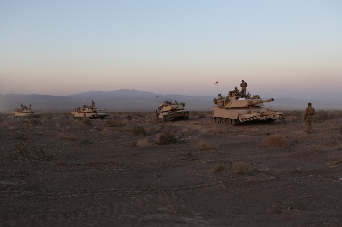 M1A1 Abrams Main Battle Tanks line up for a resupply during Exercise Desert Scimitar aboard Marine Corps Air Ground Combat Center Twentynine Palms, Calif., April 14, 2015. Desert Scimitar enables 1st Marine Division to test and refine its command and control capabilities and ensures 1st Marine Division units remain committed to consistently improving the quality of their training efforts and their resultant war fighting capabilities.