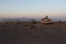 M1A1 Abrams Main Battle Tanks line up for a resupply during Exercise Desert Scimitar aboard Marine Corps Air Ground Combat Center Twentynine Palms, Calif., April 14, 2015. Desert Scimitar enables 1st Marine Division to test and refine its command and control capabilities and ensures 1st Marine Division units remain committed to consistently improving the quality of their training efforts and their resultant war fighting capabilities.