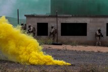 Marines with 1st Battalion, 7th Marine Regiment clear a building in a simulated combat town during the culminating event of Division School’s Urban Leaders Course aboard Camp Pendleton, Calif., April 22, 2015. The three-week course is designed to prepare Marines to lead in an urban environment.