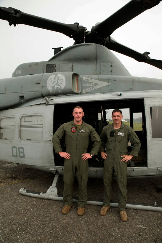 U.S. Marine Sgt. James L. Hibler, from Arlington, Texas, and Sgt. Ward M. Johnson IV, from Charleston, South Carolina, stand next to a UH-1Y Huey at the Tribhuvan International Airport in Kathmandu, Nepal, May 9. Hibler and Johnson are crew chiefs with Marine Light Attack Helicopter Squadron 469 currently contributing to the joint-service humanitarian aid mission in Nepal under JTF 505, which is composed of service members from across the U.S. military. The task force responded with joint capabilities and relief supplies after the Nepalese government requested assistance from U.S. Agency for International Development following the 7.8 magnitude earthquake that struck their country April 25.