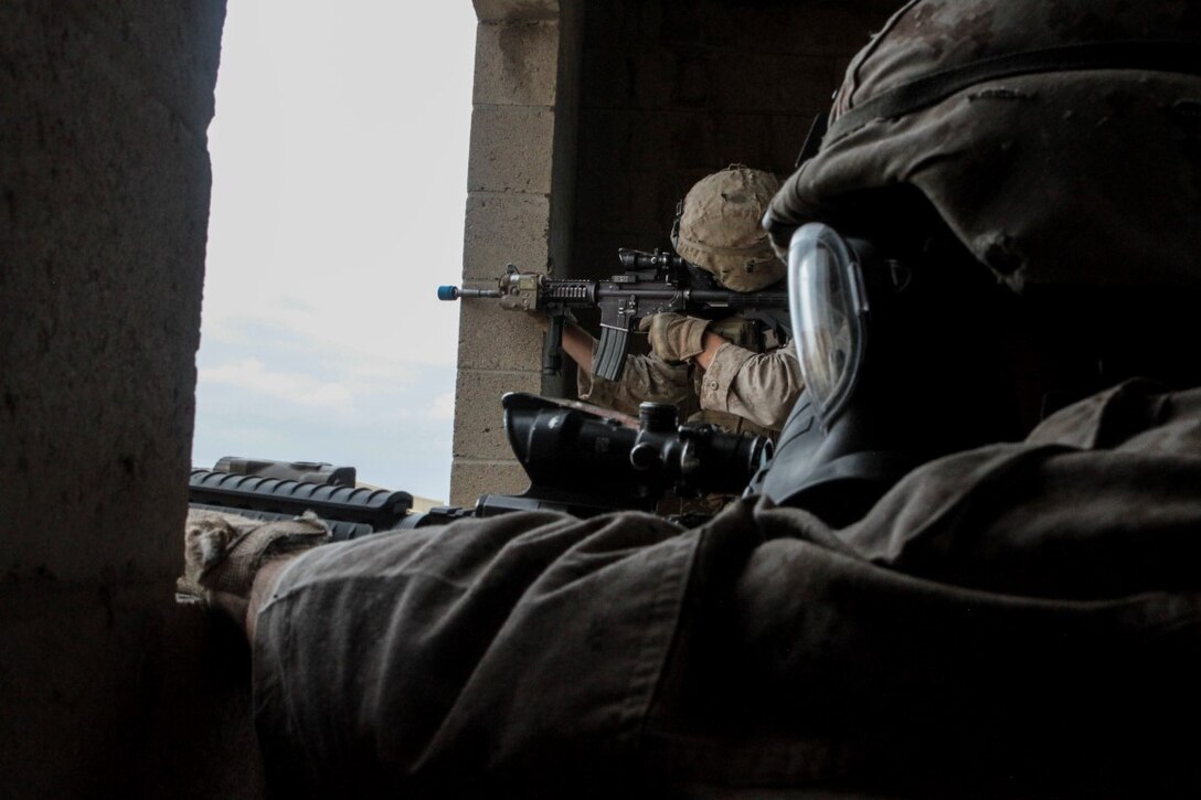 Marines with 1st Battalion, 7th Marine Regiment provide security in a simulated combat town during the culminating event of Division School’s Urban Leaders Course aboard Camp Pendleton, Calif., April 22, 2015. The three-week course is designed to prepare Marines to lead in an urban environment.