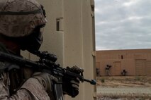 Marines with 1st Battalion, 7th Marine Regiment provide security in a simulated combat town during the culminating event of Division School’s Urban Leaders Course aboard Camp Pendleton, Calif., April 22, 2015. The three-week course is designed to prepare Marines to lead in an urban environment.