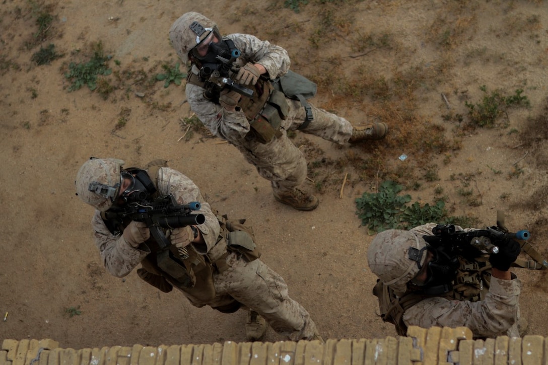 Marines with 1st Battalion, 7th Marine Regiment provide security in a simulated combat town during the culminating event of Division School’s Urban Leaders Course aboard Camp Pendleton, Calif., April 22, 2015. The three-week course is designed to prepare Marines to lead in an urban environment.