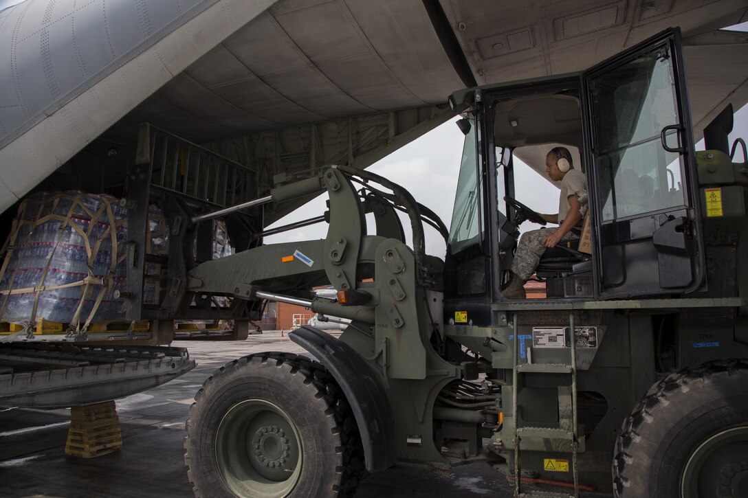 A U.S. Airman from Joint Task Force 505 unloads water from a U.S. Marine Corps KC-130 Hercules aircraft at Tribhuvan International Airport, Kathmandu, Nepal, May 9. The Nepalese government requested the U.S. government’s assistance after a 7.8 magnitude earthquake struck the country, April 25. The U.S. government ordered JTF 505 to provide unique capabilities to assist Nepal. 