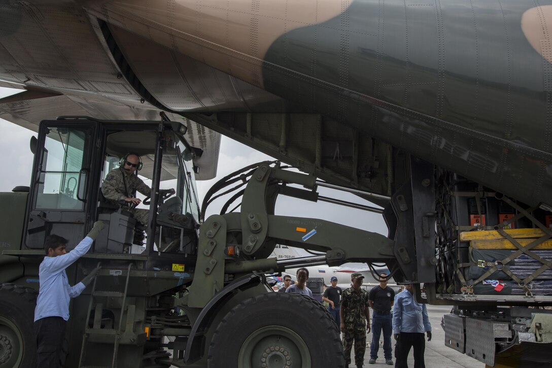 U.S. Air Force Tech Sgt. Derrick McCall, a ramp coordinator from Joint Task Force 505, operates a forklift to unload relief supplies from Singaporean military aircraft at Tribhuvan International Airport, Kathmandu, Nepal, May 9. The Nepalese government requested the U.S. government’s assistance after a 7.8 magnitude earthquake struck the country, April 25. The U.S. government ordered JTF 505 to provide unique capabilities to assist Nepal.