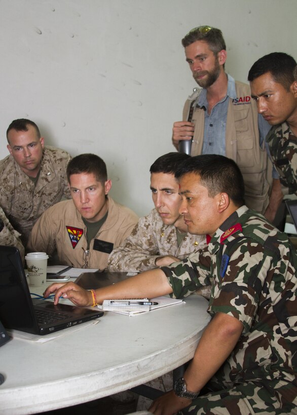 Members from Joint Task Force 505, the U.S. Agency for International Development, and the Nepalese Army conduct a multinational working group at the U.S. Embassy Annex, Kathmandu, Nepal, May 9, to discuss flight operations in support of humanitarian assistance and disaster relief.  The Nepalese government requested assistance after a 7.8 magnitude earthquake struck the country April 25. The U.S. government ordered JTF 505 to provide unique capabilities to assist Nepal.