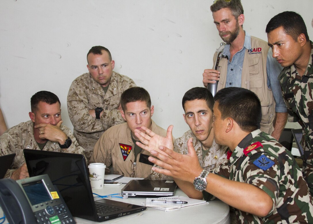 Members from Joint Task Force 505, the U.S. Agency for International Development, and the Nepalese Army conduct a multinational working group at the U.S. Embassy Annex, Kathmandu, Nepal, May 9, to discuss flight operations in support of humanitarian assistance and disaster relief.  The Nepalese government requested assistance after a 7.8 magnitude earthquake struck the country April 25. The U.S. government ordered JTF 505 to provide unique capabilities to assist Nepal.