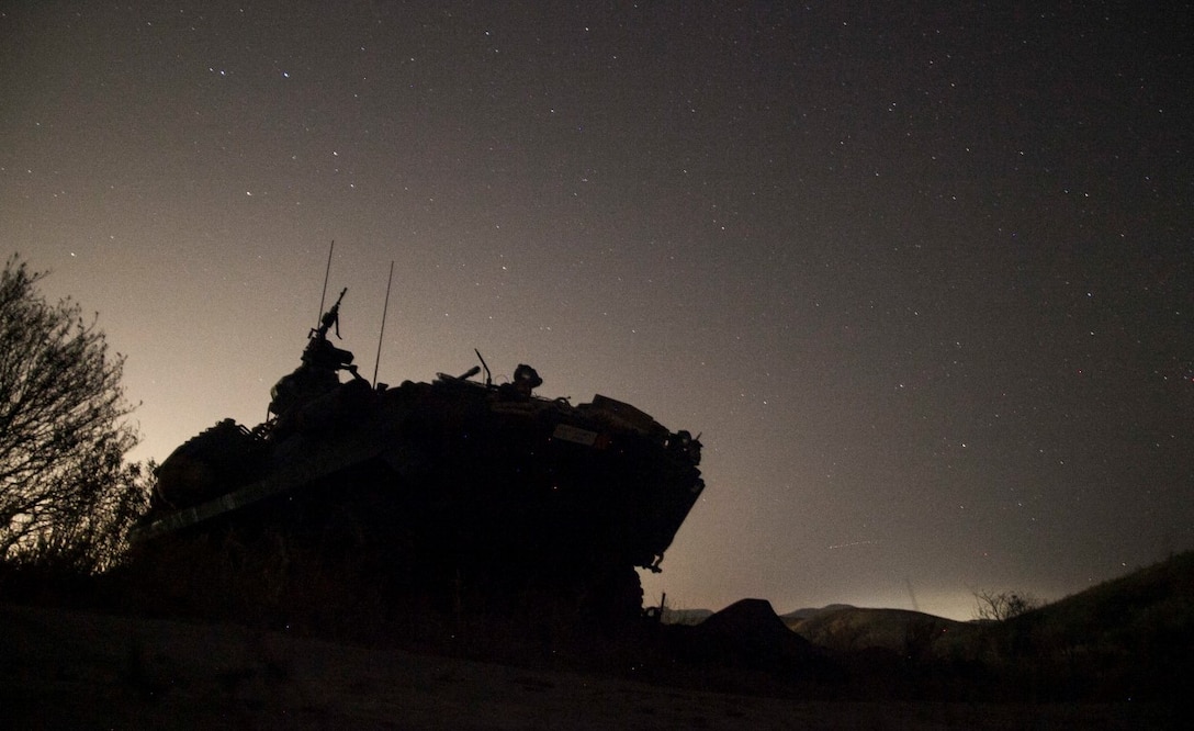 A Light Armored Vehicle (LAV-25) with 1st Light Armored Reconnaissance Detachment, Battalion Landing Team 3rd Battalion, 1st Marine Regiment, 15th Marine Expeditionary Unit, provides security for an amphibious raid during Certification Exercise (CERTEX) aboard Camp Pendleton, Calif., April 19, 2015. The Marines with the 1st LAR Det honed their skills as they prepare for their upcoming deployment. (U.S. Marine Corps photo by Cpl. Elize McKelvey/Released)