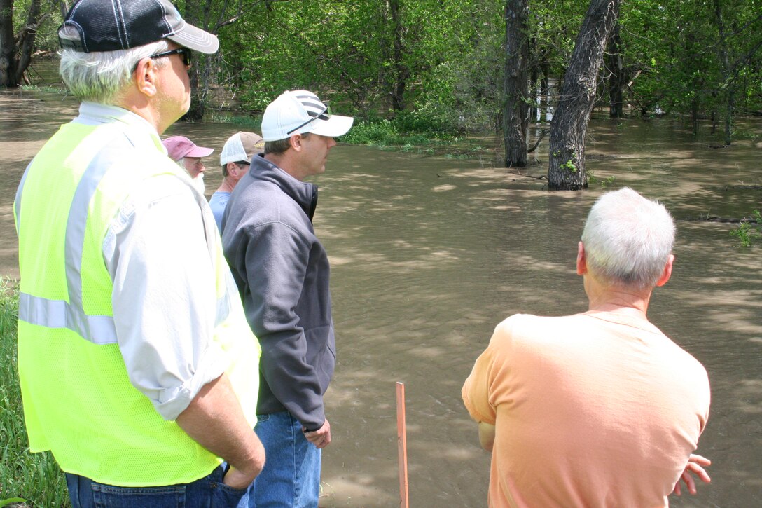 Teams from the Omaha District, U.S. Army Corps of Engineers and the Lower Platte South Natural Resources District evaluate an area on the land side of the Salt Creek levee in Lincoln. Bubbles are often an indication of a boil that is flowing water. After closer inspection, these bubbles were not from a boil.